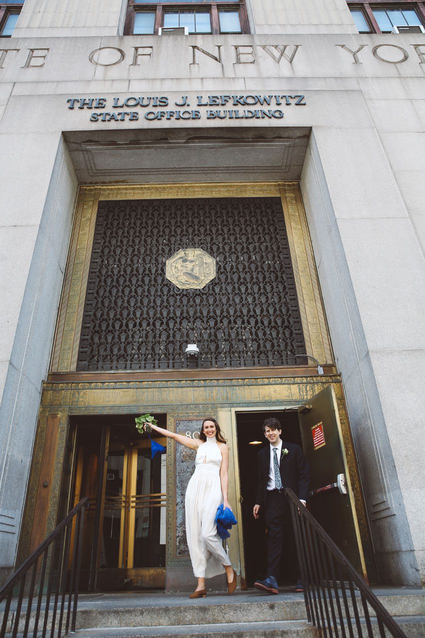 exiting the city hall marriage bureau just married
