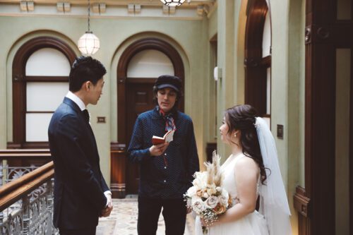 Officiant and couple at the Beekman Hotel in NYC