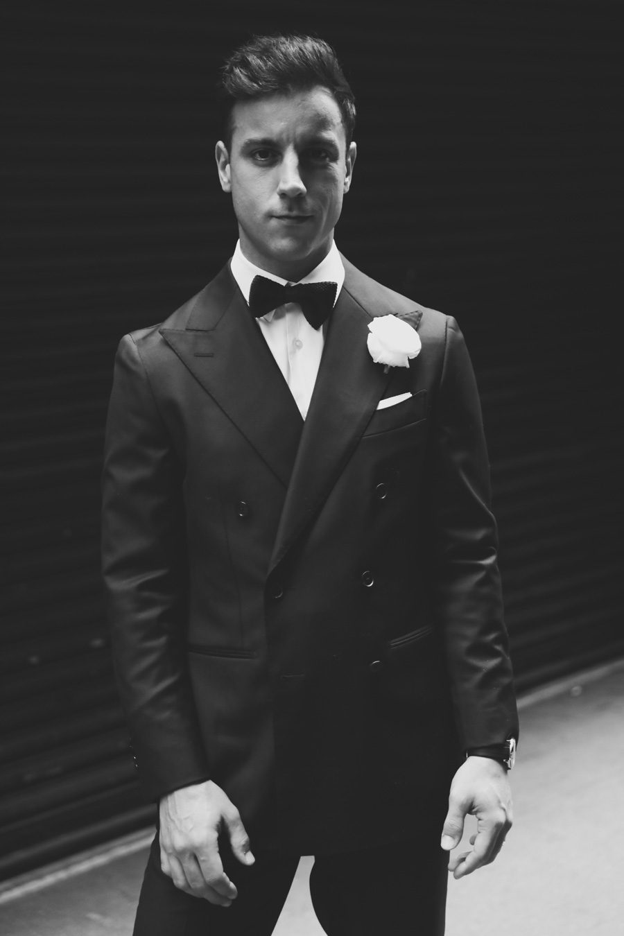 broom in black tie attire