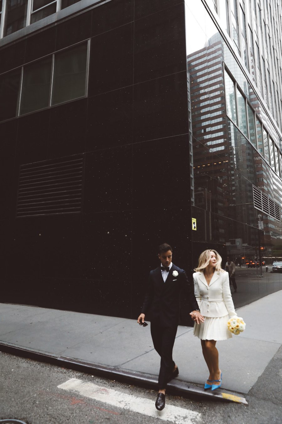 a couple about to cross a nyc street