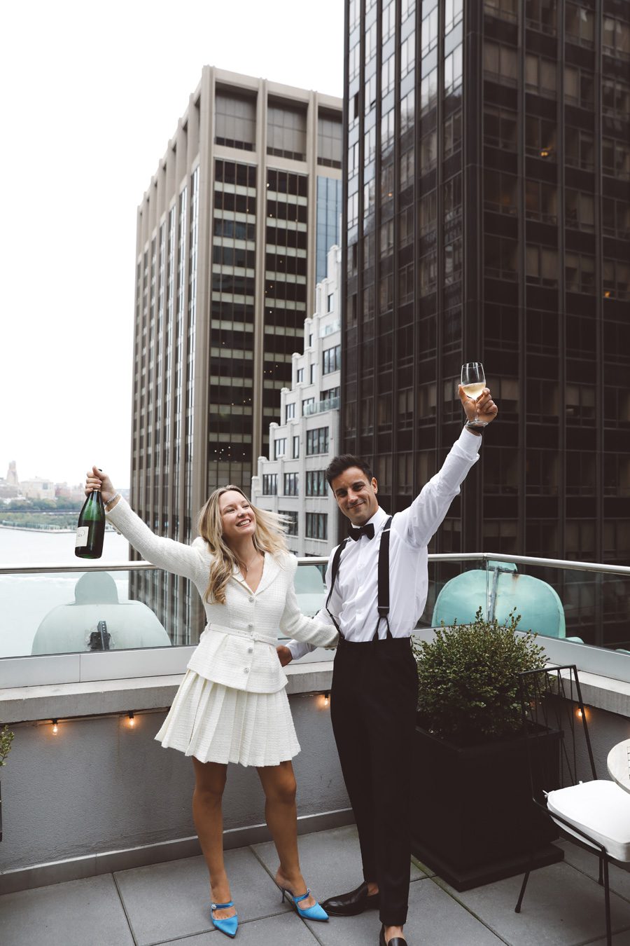 couple toasting for their nyc elopement