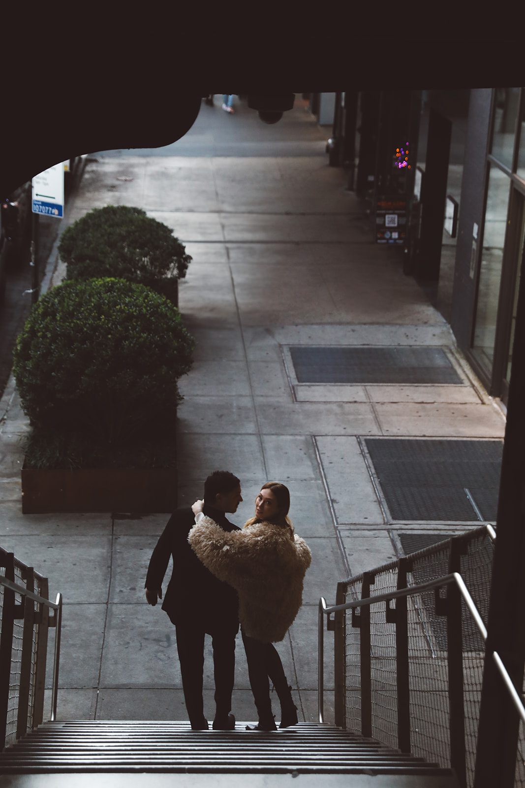 Deidre Steven | L&L Style Photo NYC Elopement Photography of a couple down the stairs of the Highline Park