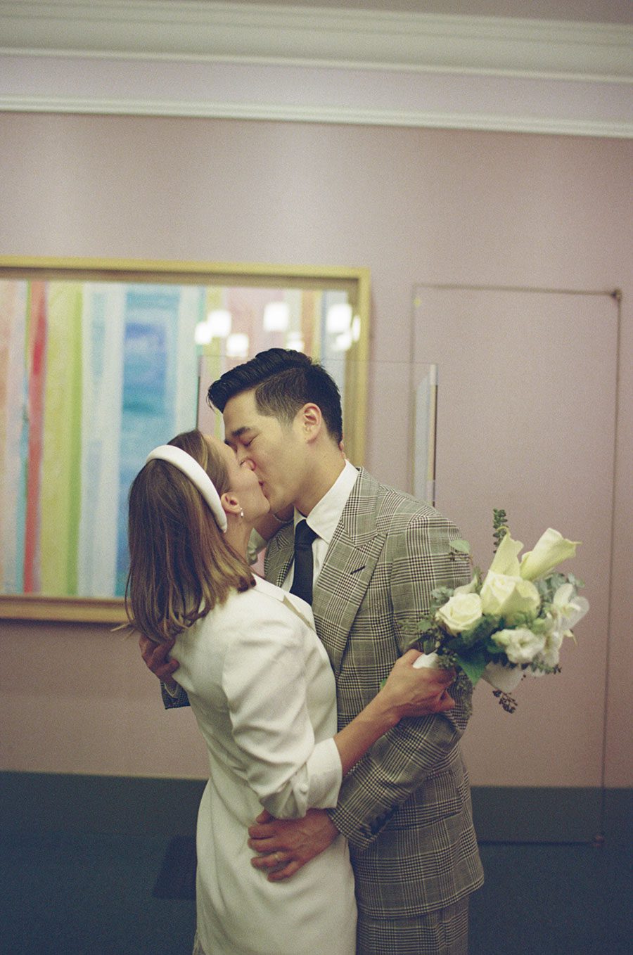 City Hall wedding couple kissing in film