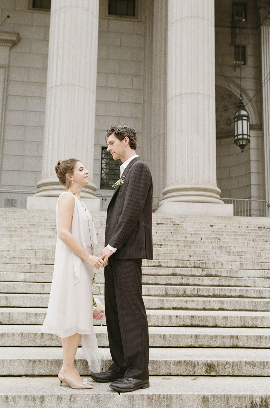 Couple captured on the steps of the NY City Hall